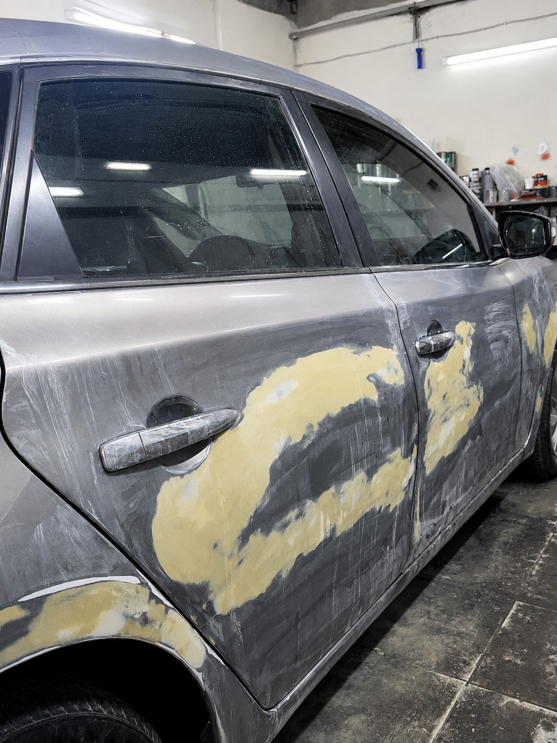 Side panels of a vehicle undergoing surface preparation